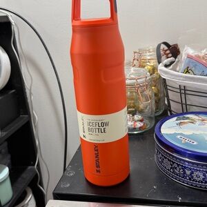 - 36oz tigerlily plum color Stanley iceflow bottle with cap and carry lid